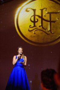 49th Annual Heritage Ball Megan Alexander on stage photo credit Kris Rae Photography.