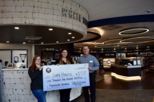 Tri Star Energy presents a donation check to Safe Haven Family Shelter's Chief Development Officer, Rachael Wilkins.