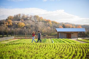 Couple walking outdoors at Southall Farm & Inn, Luxury Spa Resort in Franklin, TN.