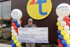 Brandon Trainer receives check from TD.