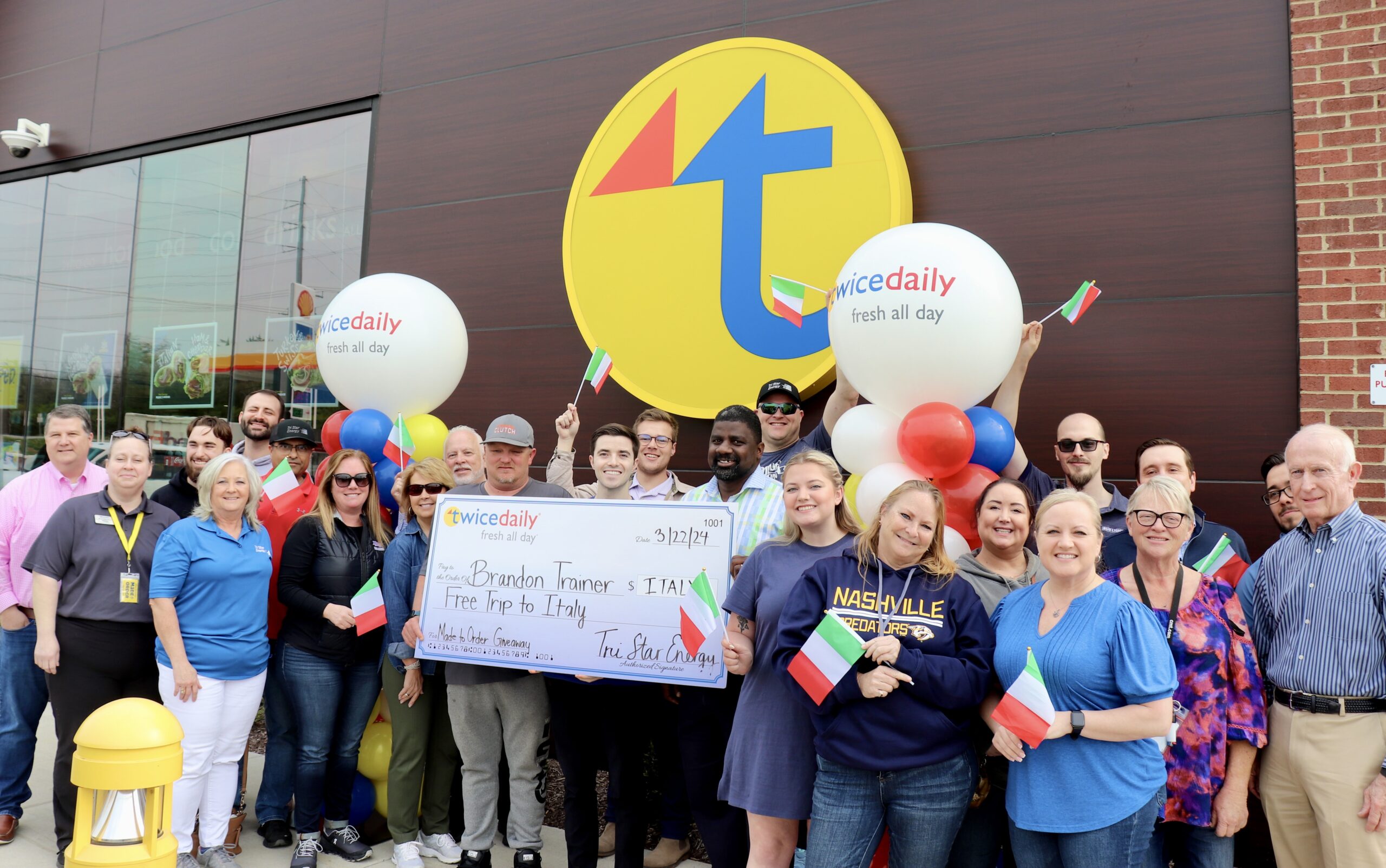 Nashville Twice Daily Team poses with contest winner, Brandon Trainer.