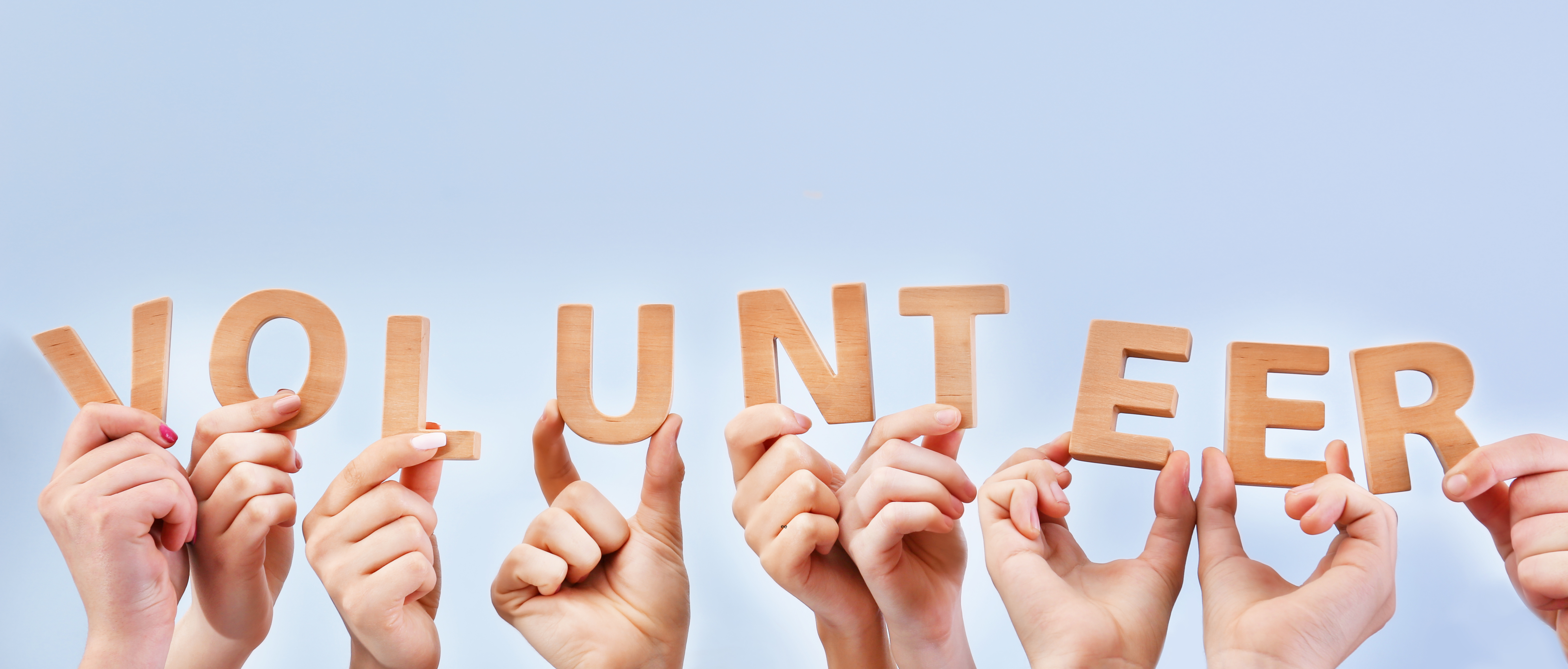 hands holding volunteer letters