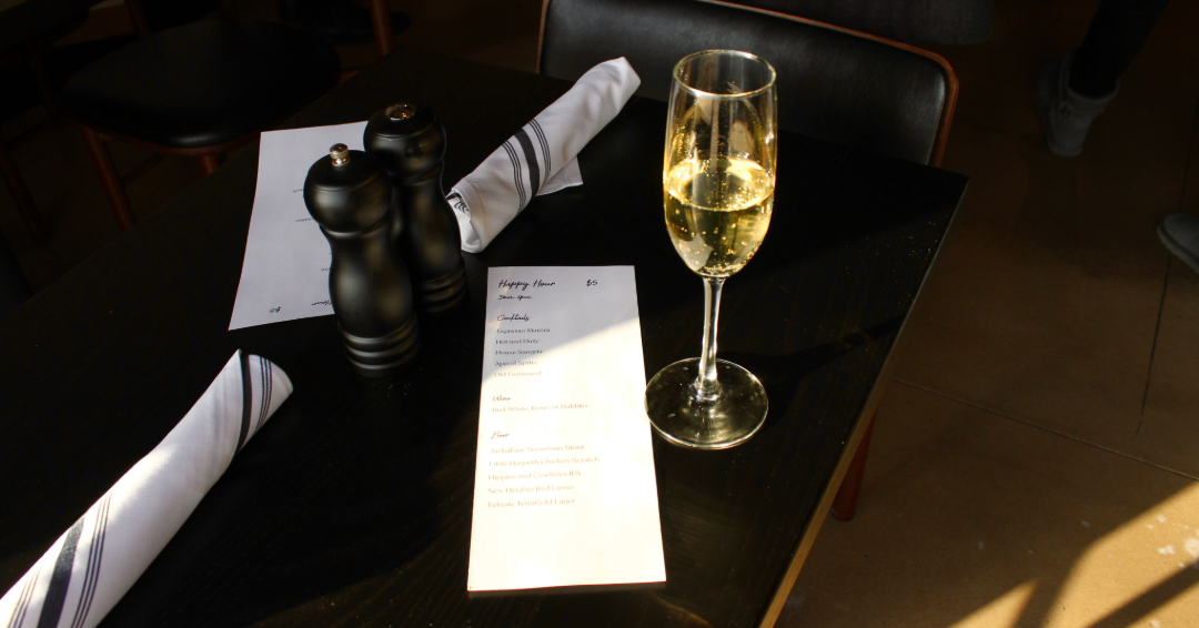 Champagne and a Happy Hour menu at Karrington Rowe in Brentwood, TN, a restaurant and bar with happy hour specials and delicious food in an upscale and casual setting.