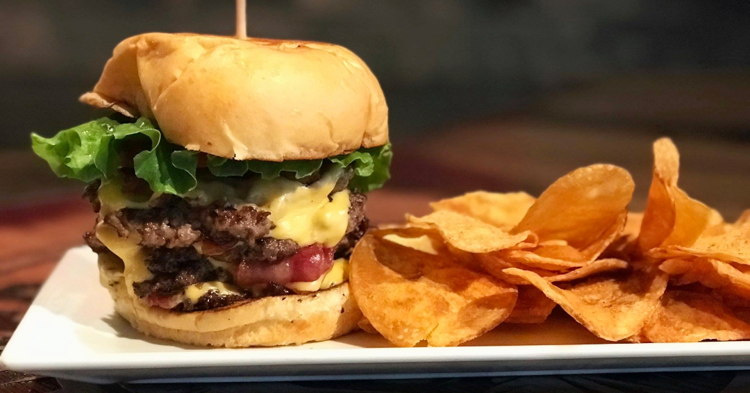 A photo of a burger and chips from Burger Republic in The Gulch neighborhood in Nashville, TN.