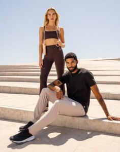 Vuori Franklin, TN store now open, a woman and man wearing Vuori apparel, shoes and accessories.