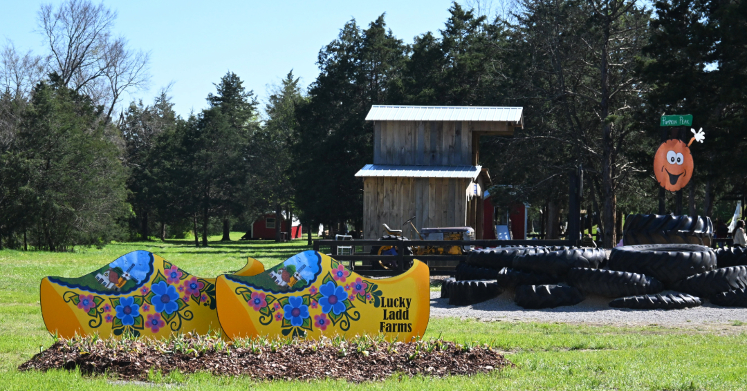 A clog shaped sign for Lucky Ladd Farms Fun Park in Eagleville, Tennessee.