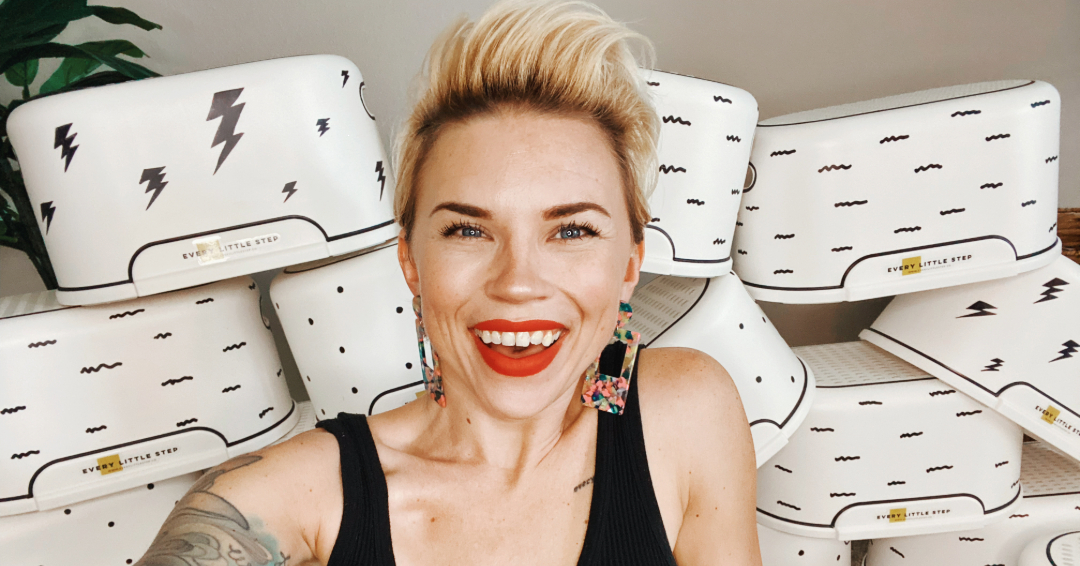 Anna Skates, creator of the "Every Little Step Campaign" smiles in front of illustrated stepstools given to local businesses in Middle Tennessee to promote accessibility for children in public bathrooms. 