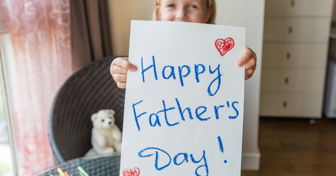 Girl holding Father's Day Card