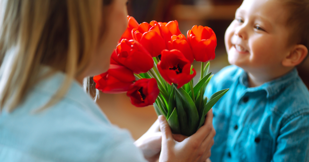 Young boy giving Mothers Day flowers Franklin tn