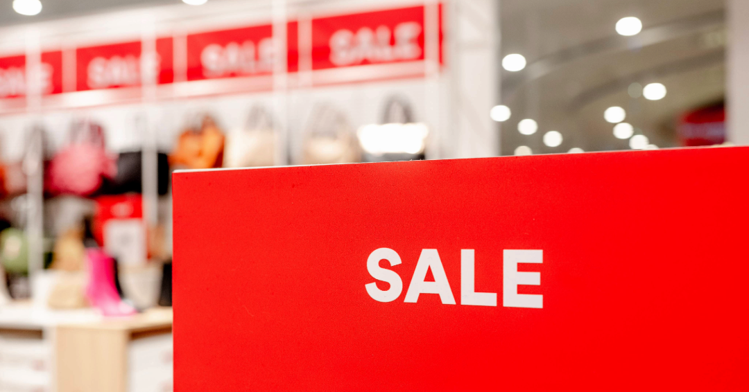 Store "sale" sign: discount, budget-friendly shopping in Williamson County, Tennessee.