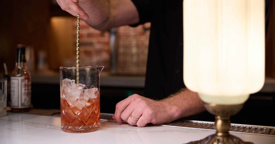 A bartender making drinks, happy hour cocktails at the white alligator in Franklin, Tennessee.
