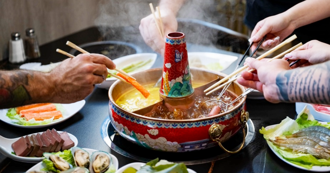 Friends gather around a hotpot from Beijing Hotpot in Franklin, Tennessee, where you can enjoy international dining.