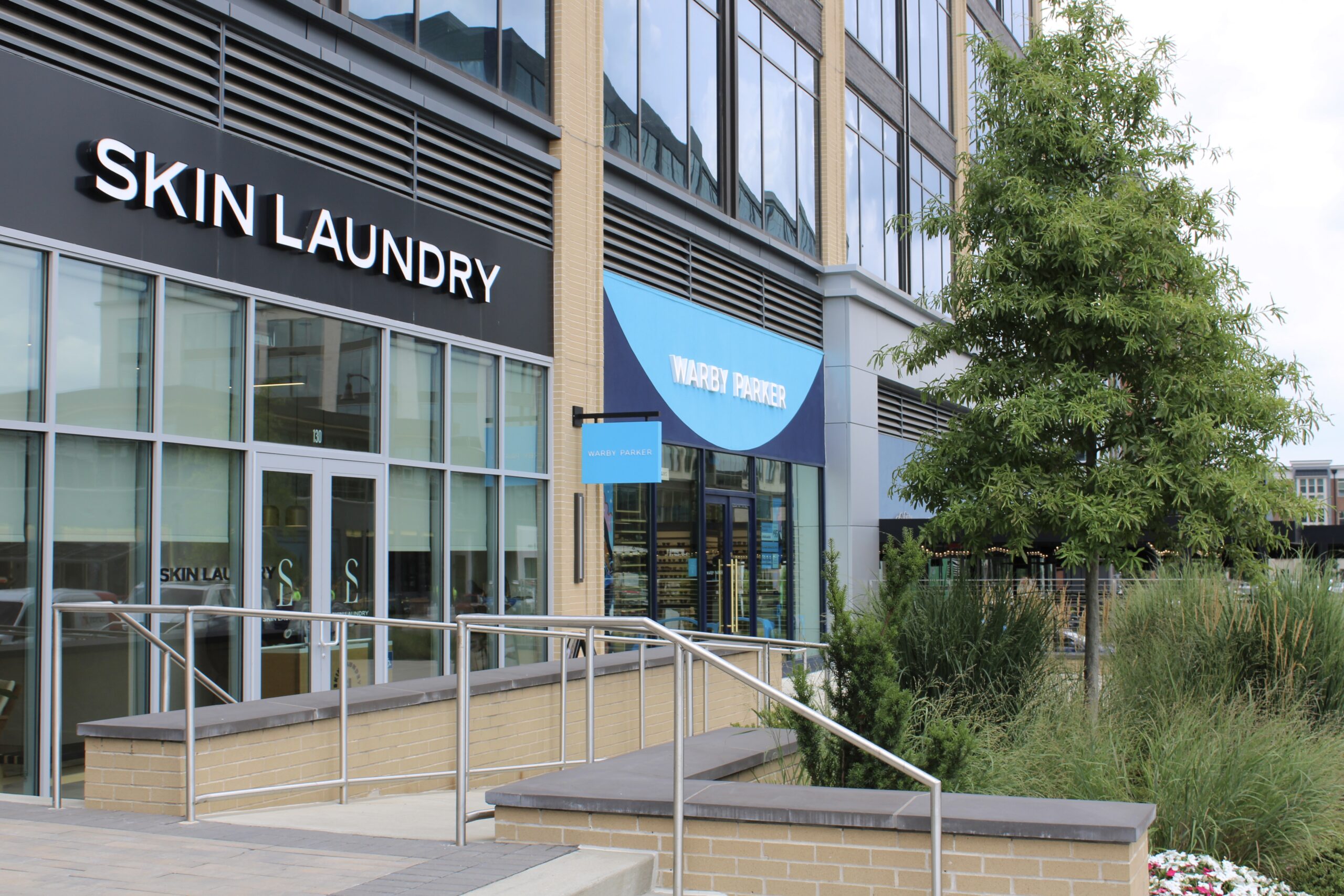 McEwen Northside shopping in Franklin, Tenn., Skin Laundry, Warby Parker and more shops down the sidewalk.