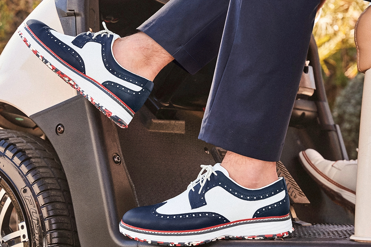Men’s shoes in Franklin and Brentwood, TN, featuring a pair of two-tone athletic wingtip shoes with white laces and patterned soles.