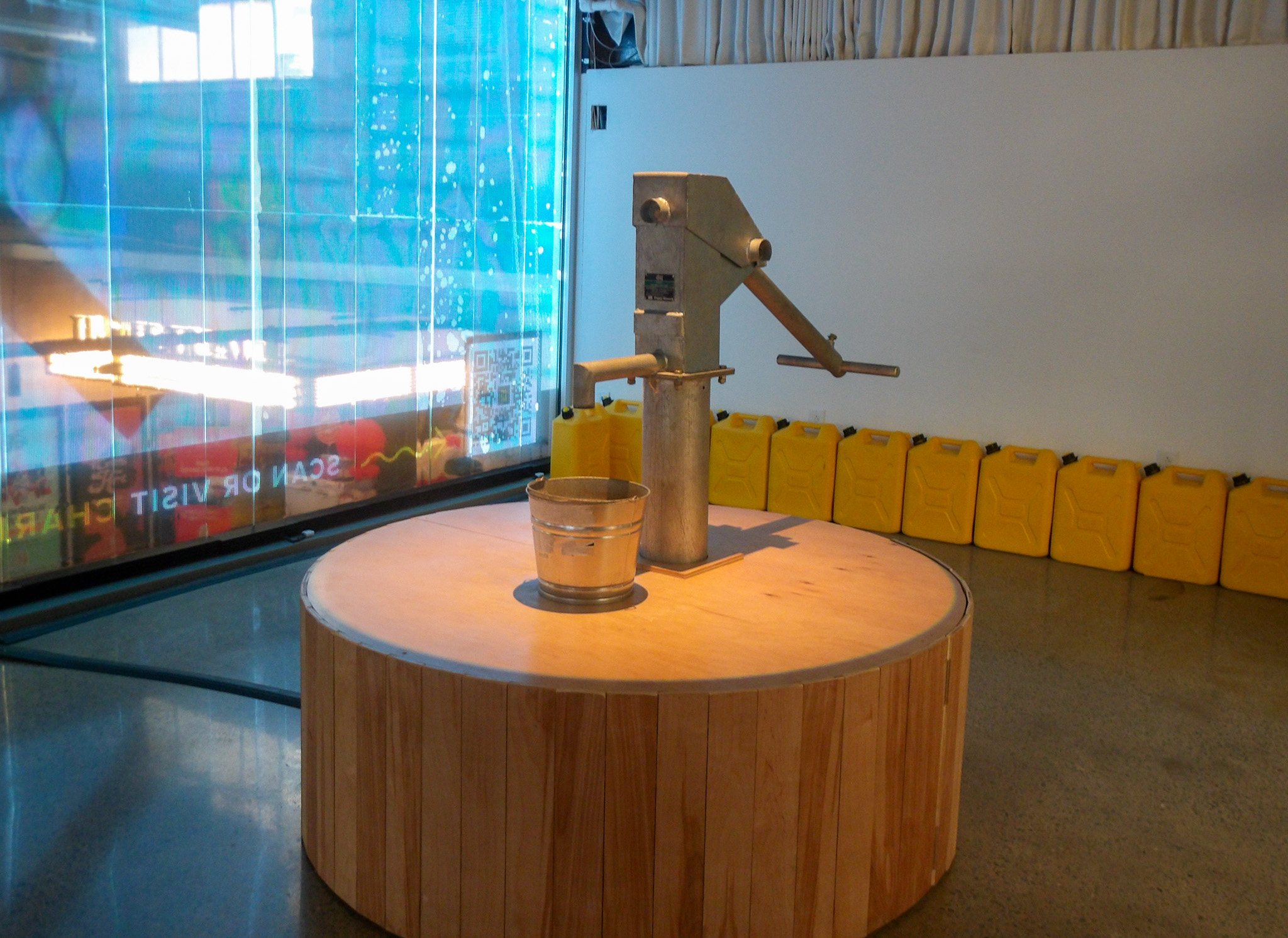 The charity: water exhibit at The Experience Lab in The Factory at Franklin, a water pump is part of the exhibit.