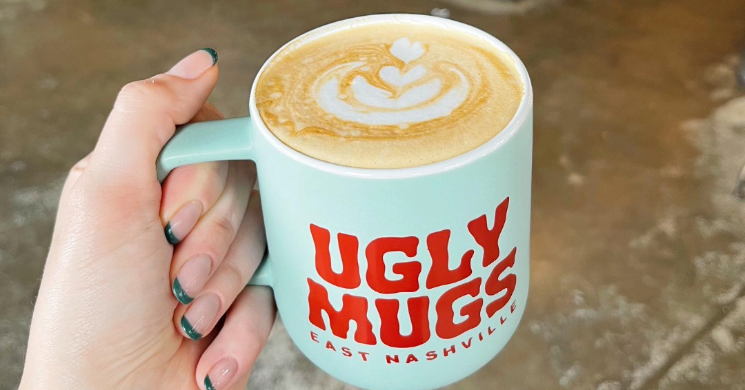 Holding a cup at Ugly Mugs, a coffee shop in East Nashville, Tennessee. 