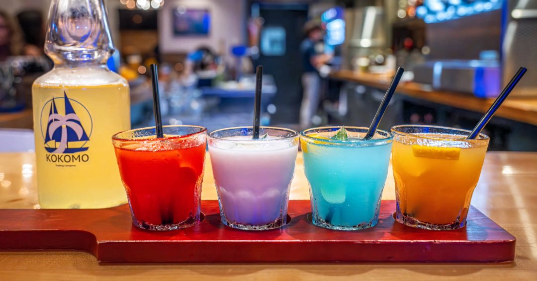 A flight of colorful drinks at Kokomo Trading Company in Franklin, Tennessee, a Caribbean inspired restaurant where you can find international cuisine.