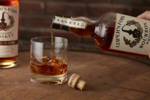 Leiper's Fork House of Spirits in downtown Franklin, TN, a distillery, tasting room, and restaurant with craft cocktails, spirits (bourbon, gin, vodka), live music, educational whiskey experiences (history, lab), and a cozy lounge vibe with local beers and retail bottles to buy.