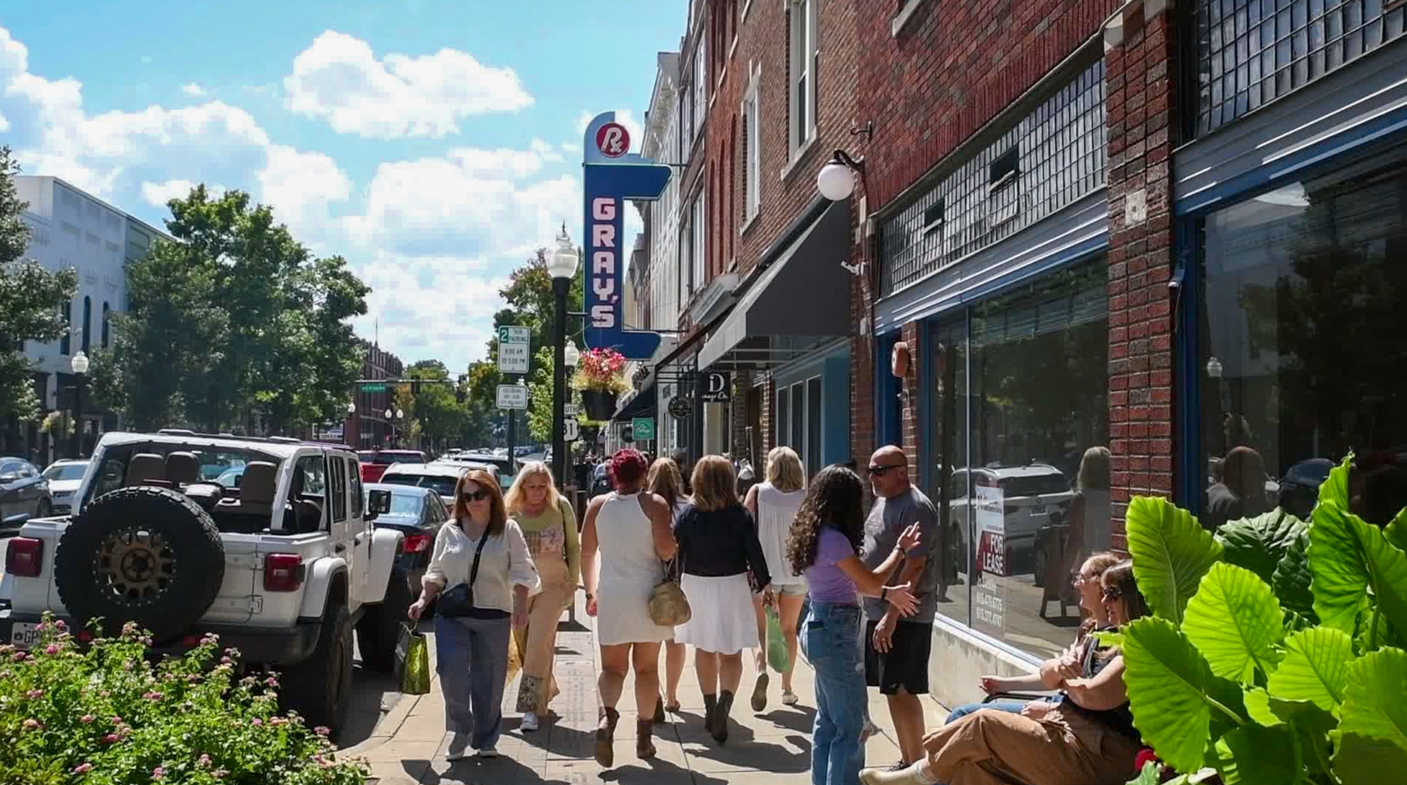 Downtown Franklin, TN's Main Street, people shopping and visiting bars and restaurants on Main Street.