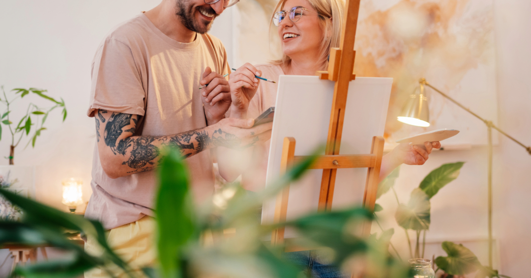 A couple goes on an artistic date night in Franklin, Tennessee, painting on a canvas together. 