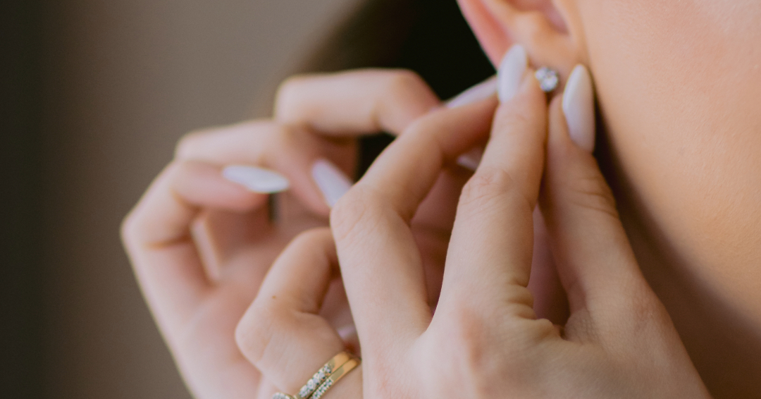 A woman puts on earrings, getting dressed up for a nice date in Williamson County, Tennessee.